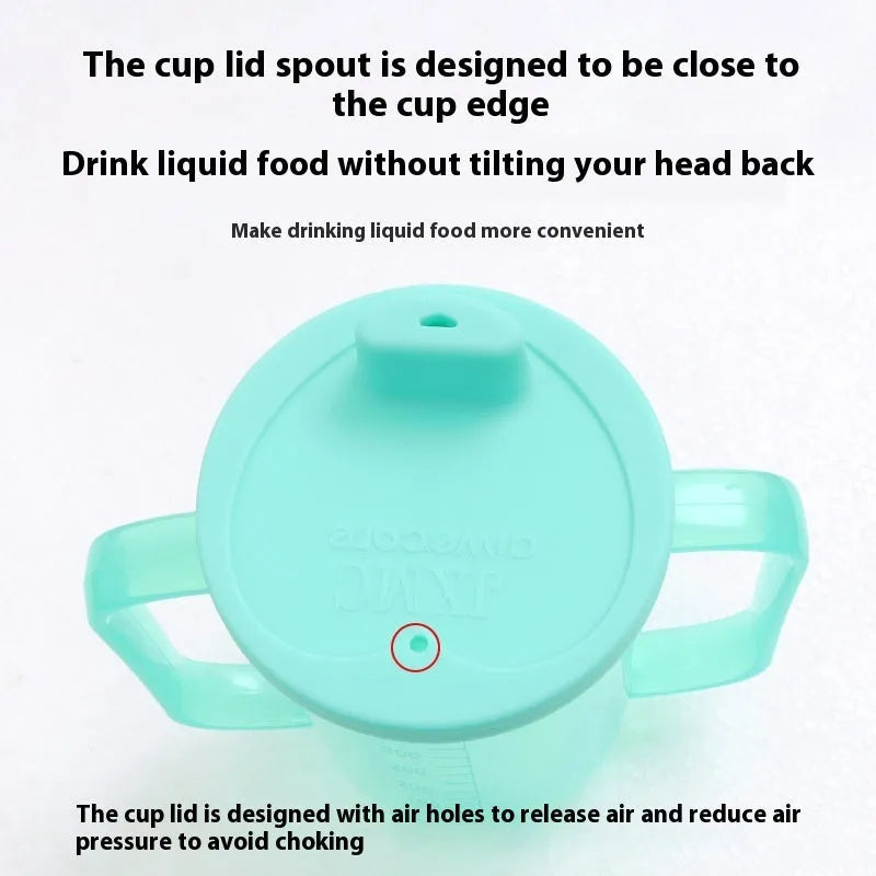 A white PP plastic choke-proof drinking cup with an angled spout, handle, and lid, shown on a bedside table.