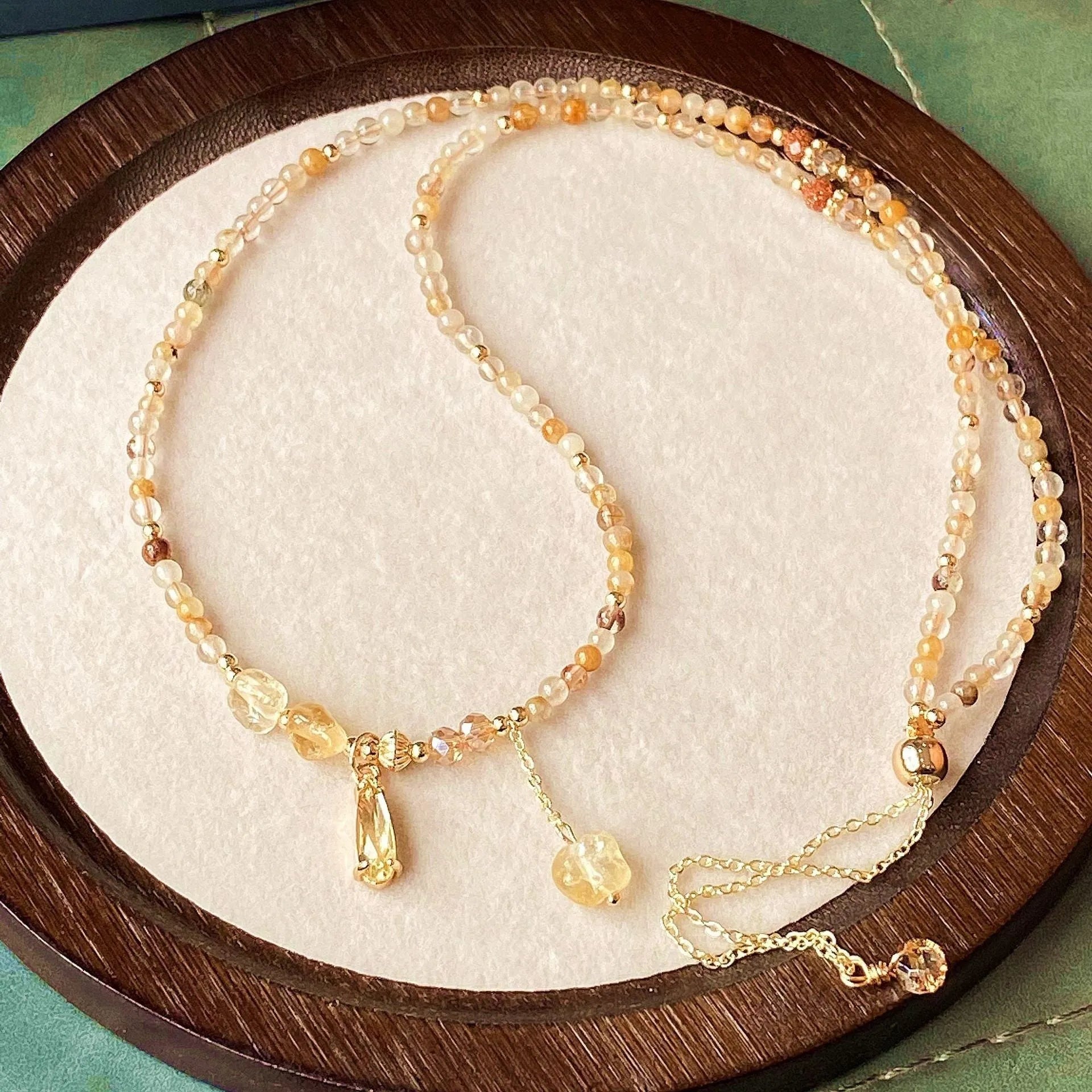 Gold multi-layer bracelet with citrine crystals and three-circle Saturn design