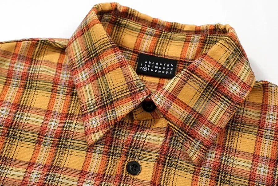 Men's yellow grid plaid short sleeve loose fit shirt on plain background