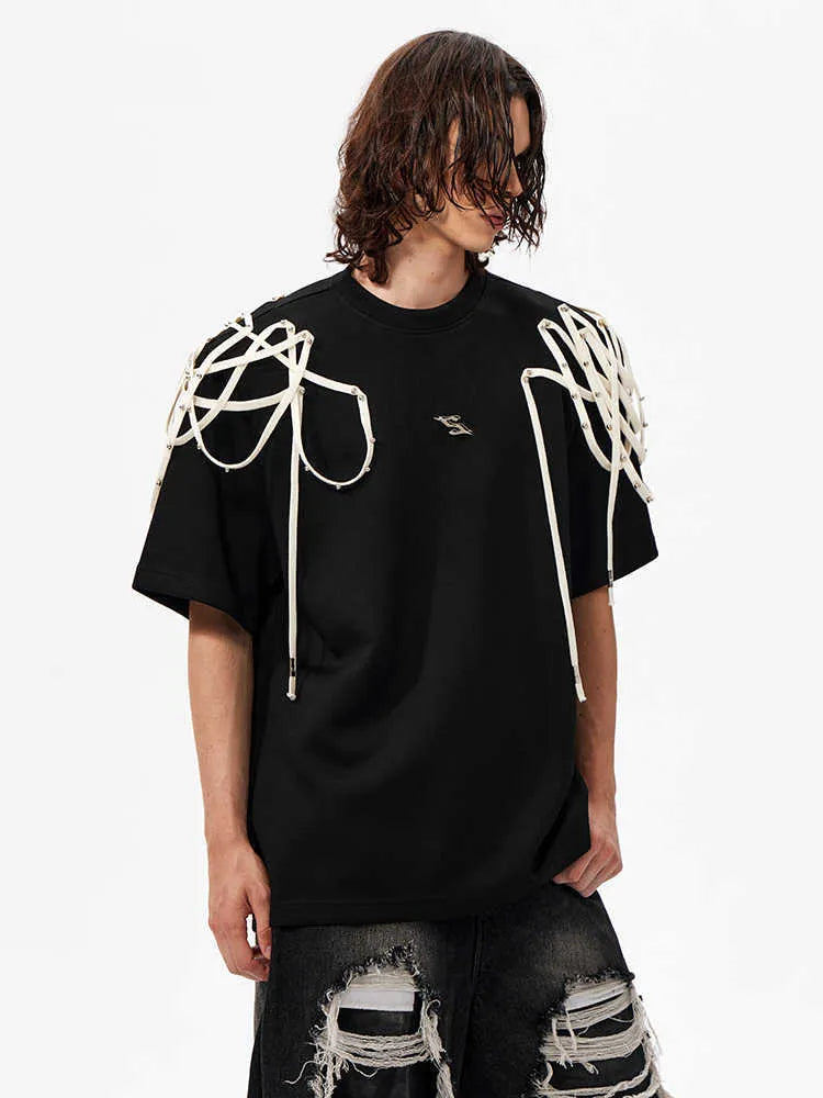 Black loose fit T-shirt with padded shoulders featuring rivet ribbon detailing, short sleeves and round neck collar