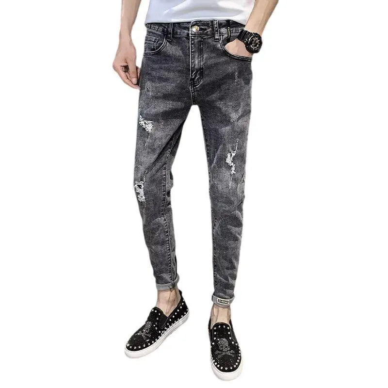 Men's classic high waist blue denim jeans with a button fly, shown laid flat.