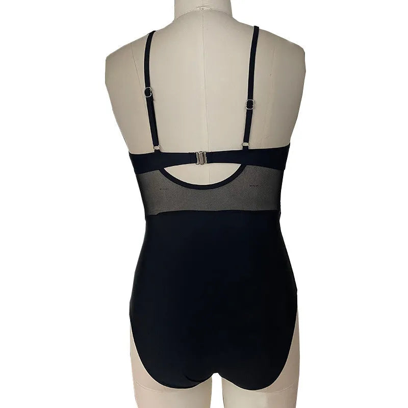 Women's mesh spliced backless one-piece swimsuit in solid black colour with polyester lining, Asian sizes S to 2XL