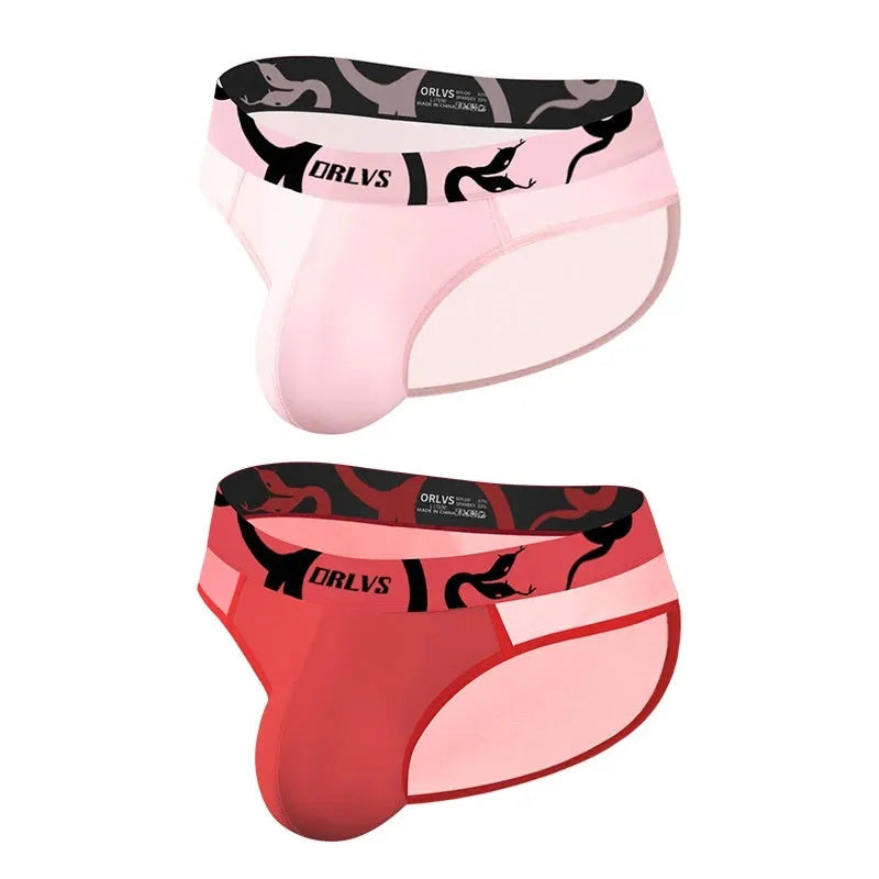 Men's solid colour modal boxer shorts in black, pink, and red with low waist design