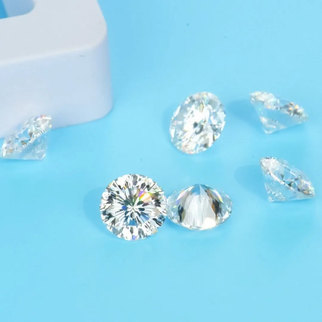 Round moissanite gemstone displaying the eight hearts and eight arrows faceting pattern on a neutral background.