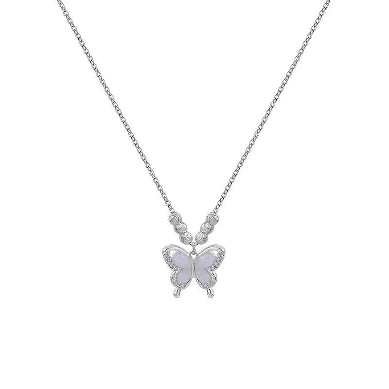 Women's silver butterfly necklace on a cross chain, showing adjustable length.