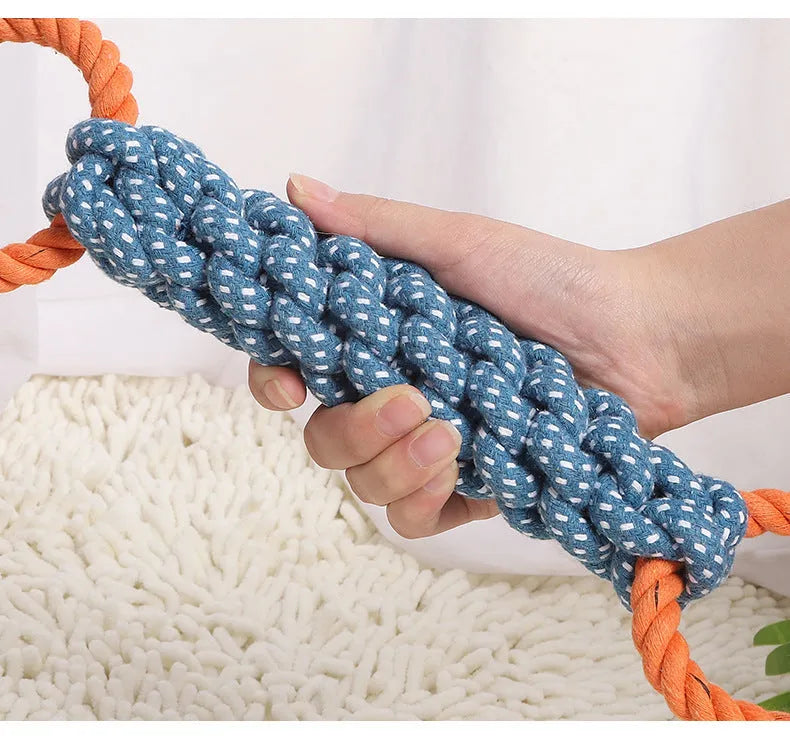 Blue braided cotton rope bone dog toy with double rings at each end for chewing and tooth cleaning