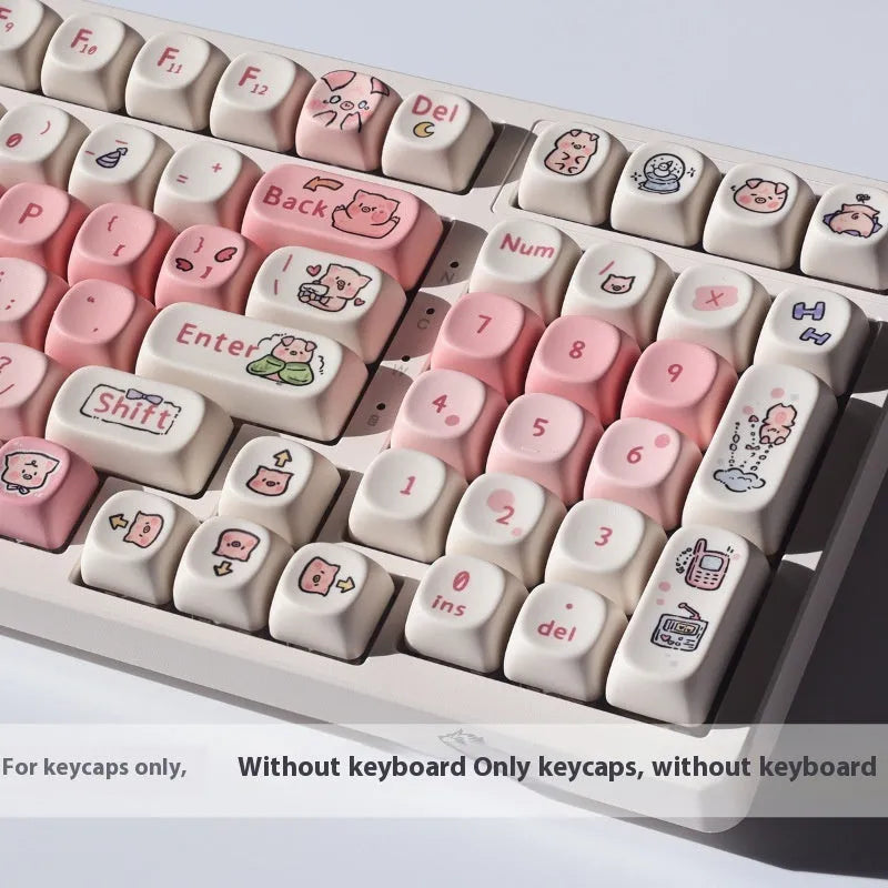 Set of pastel pink PBT key caps with a fragrant pig design, shown with a key puller tool.