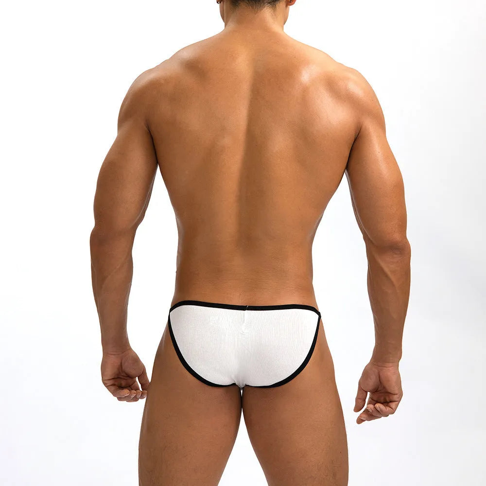 Men's low waist briefs in grey rib weave fabric showing narrow edge design and single layer construction