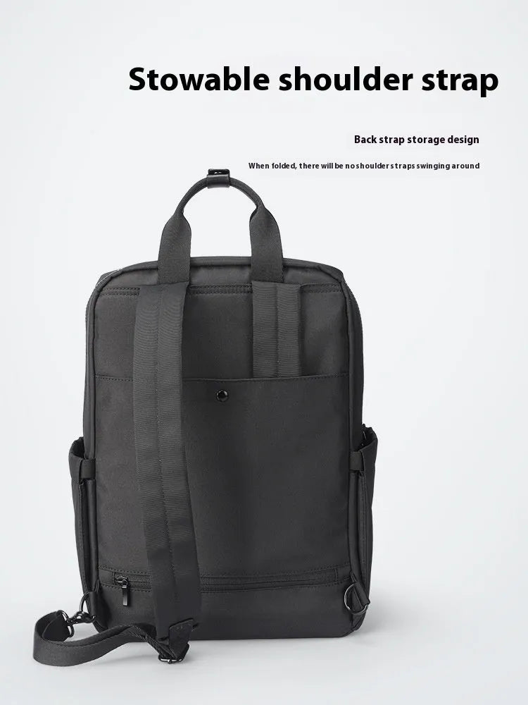 Black Oxford cloth computer backpack showing front view and storage compartments.