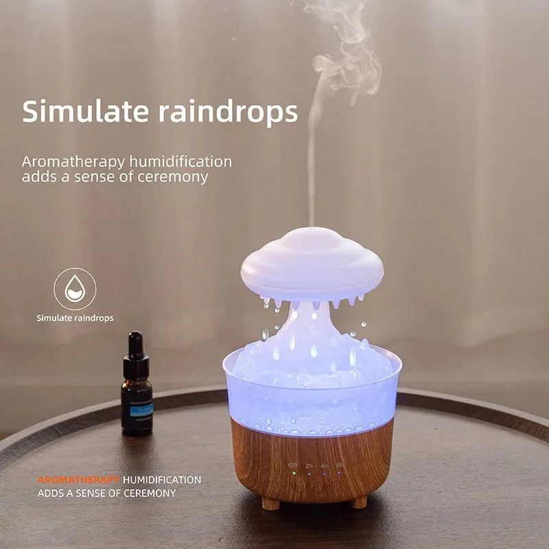 Wood grain white rain cloud humidifier diffuser with glowing LED light and water droplets.