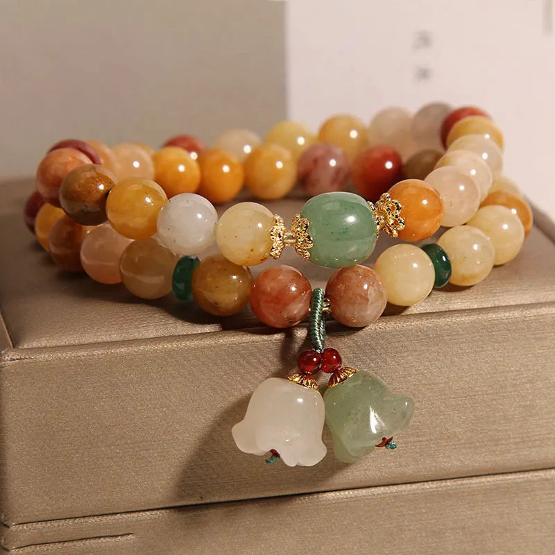 Natural Jinsi Jade multi-layer women's bracelet with adjustable cord tie closure and orchid pendant