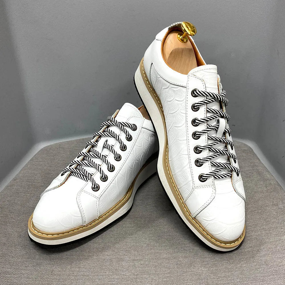 Men's white low-top casual shoes with embossed pattern texture on the front, featuring front tie laces.