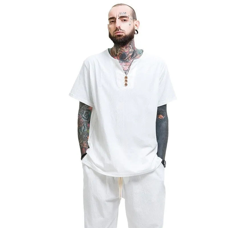 Loose grey cotton T-shirt for men on a hanger, showing short sleeves and pullover style.