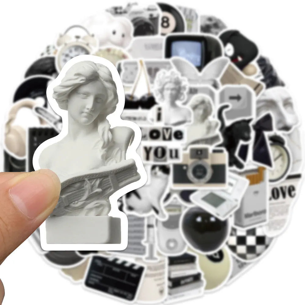 61-piece black and white waterproof PVC sticker set for laptops, phones, and cups.
