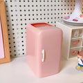 White refrigerator-shaped PP plastic pencil case with large capacity on a desk, size 10.7x9.8x7.5cm