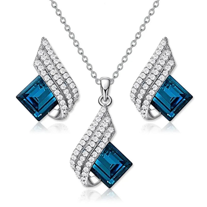 Silver-tone cross chain necklace and matching earring set with glass pendant details