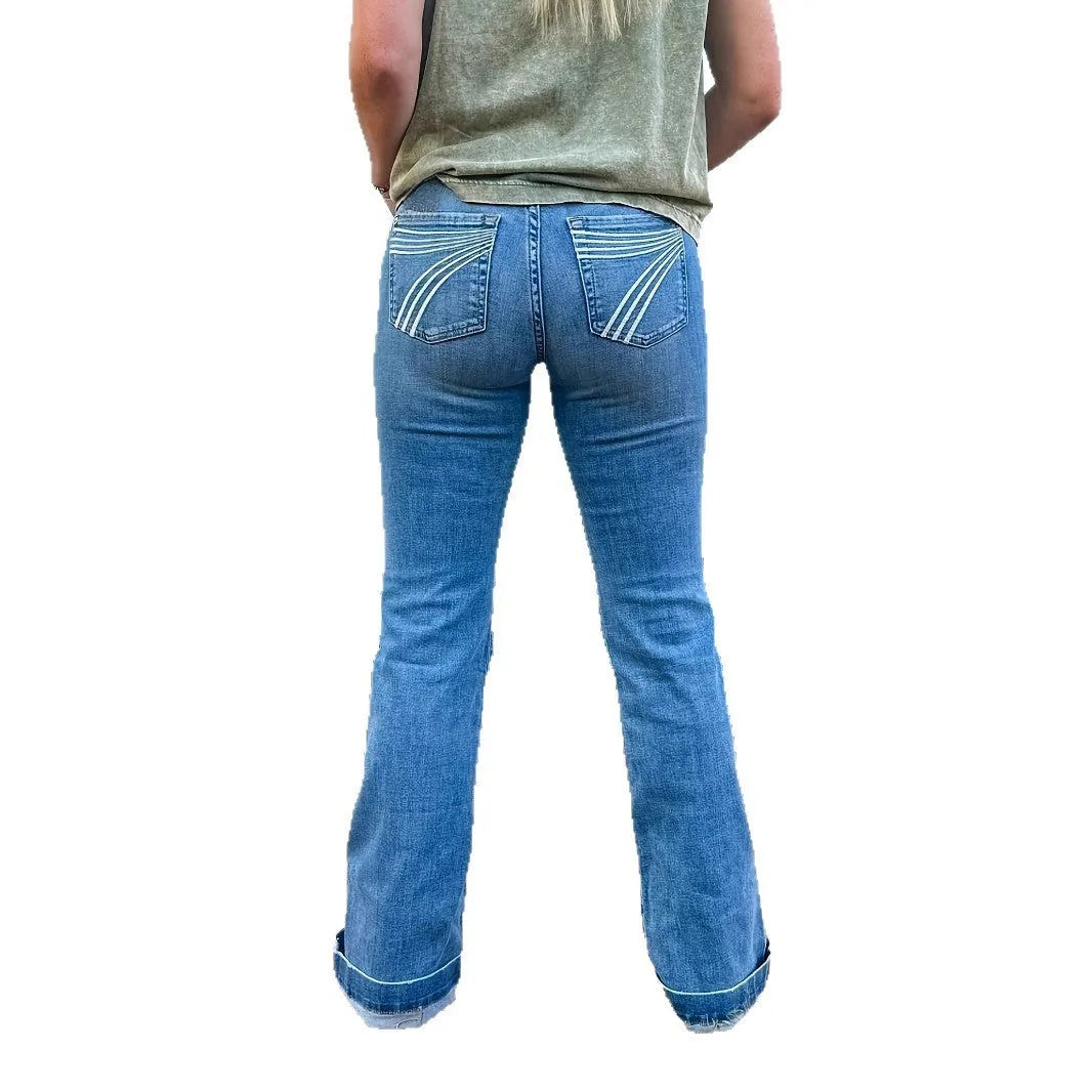 Slim fit blue embroidery jeans with a slight flare and elastic mid-waist.