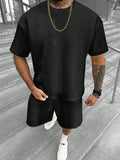 Men's printed short sleeve top and matching shorts leisure suit set on a hanger.