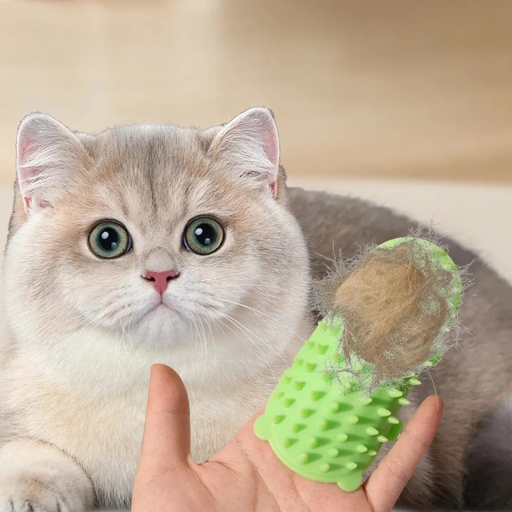 Silicone cat grooming comb with rounded teeth and adjustable strap mounted on a table leg.