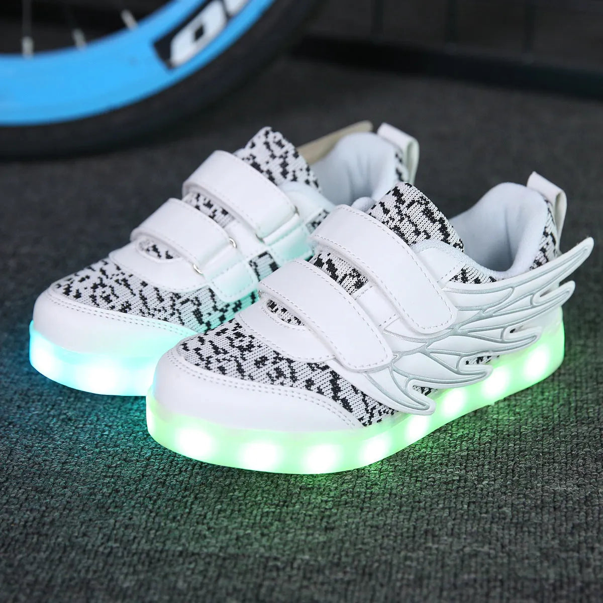 Children's plum red and white LED light up casual sneakers with USB charging port.
