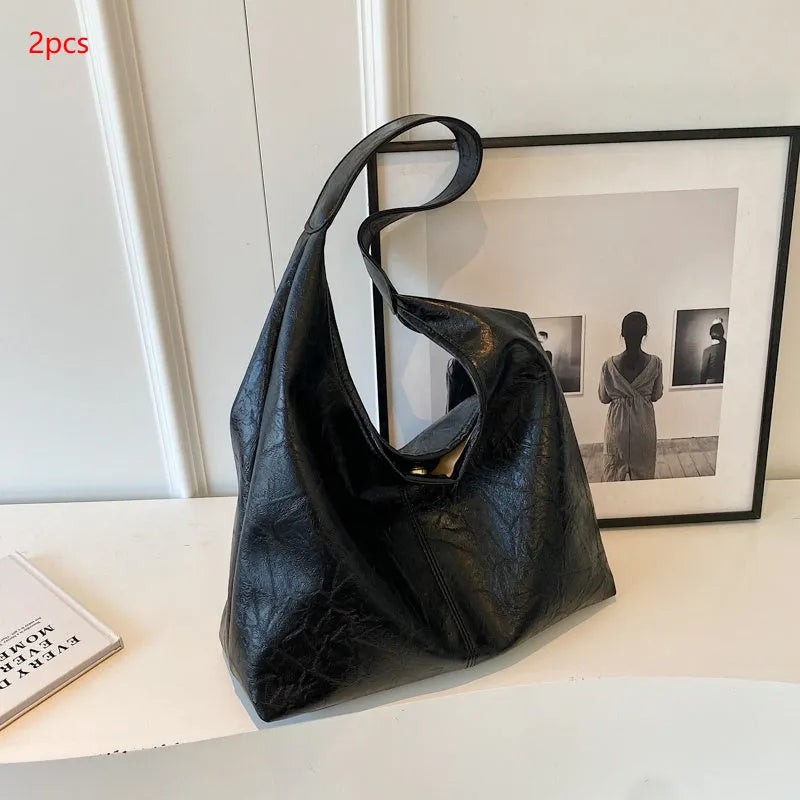 Soft PU leather large capacity shoulder bag in multiple colours with front sandwich pocket.