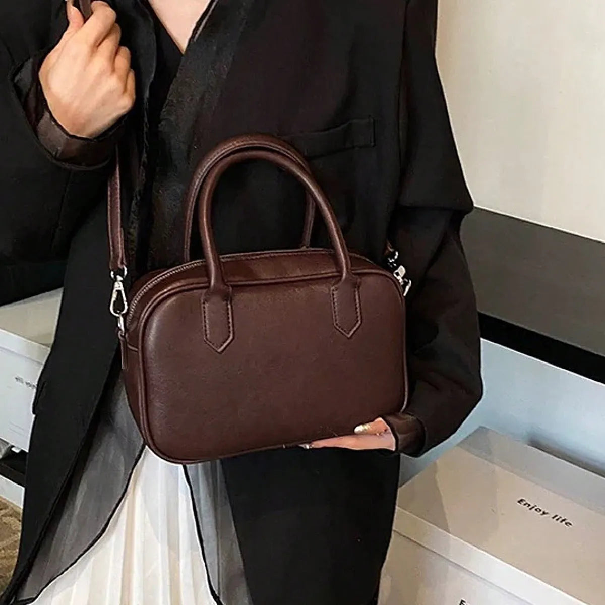 Small square retro messenger bag in black or coffee colour with single shoulder strap