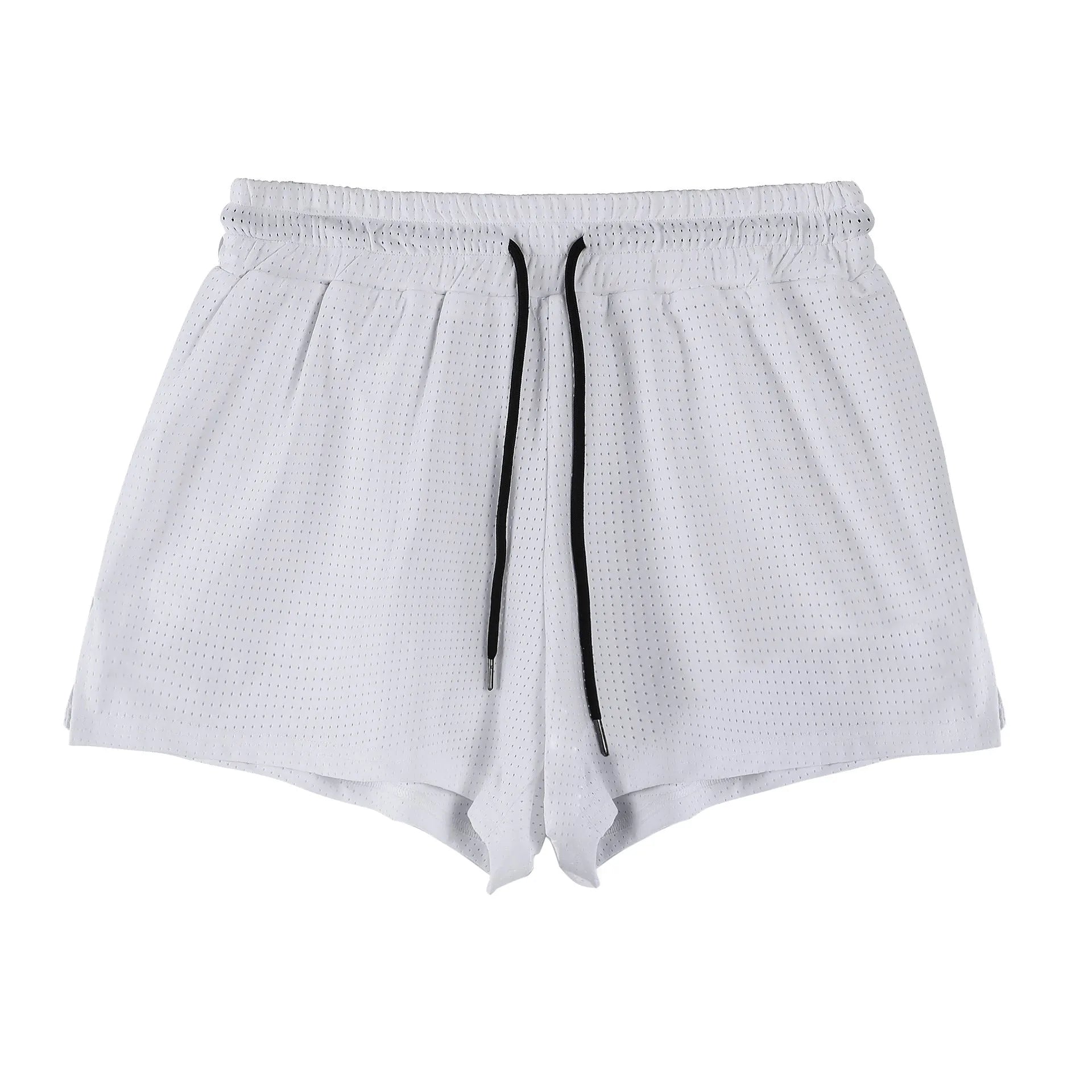 Man wearing black quick-dry nylon summer shorts on a light background
