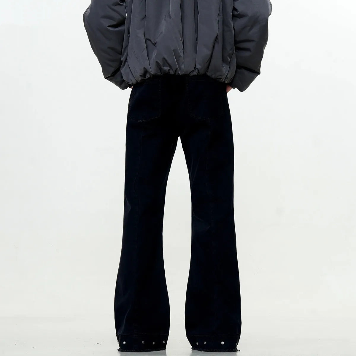 American retro straight-leg skinny jeans in black cotton denim laid flat.
