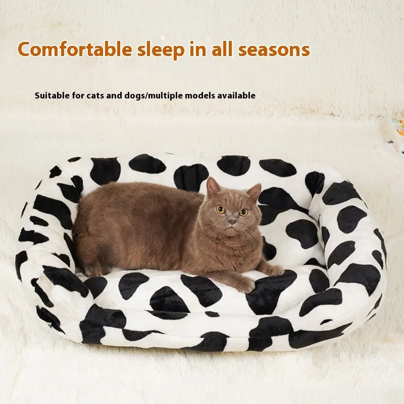 Four Seasons universal kennel dog bed in cow colour cloth, available in sizes S to XL from 30 to 85 cm