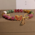 Natural jade coloured tourmaline bracelet with butterfly gourd pendant on adjustable agate bead band