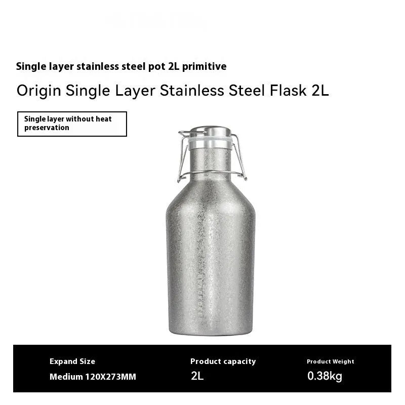 Large stainless steel outdoor thermal pot with a handle, shown in a natural setting.