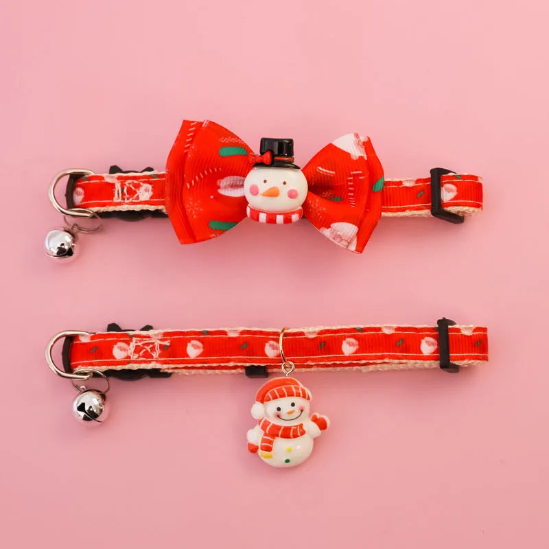 Christmas pet collar with bow tie, bell, and adjustable strap featuring Santa Claus and tree patterns
