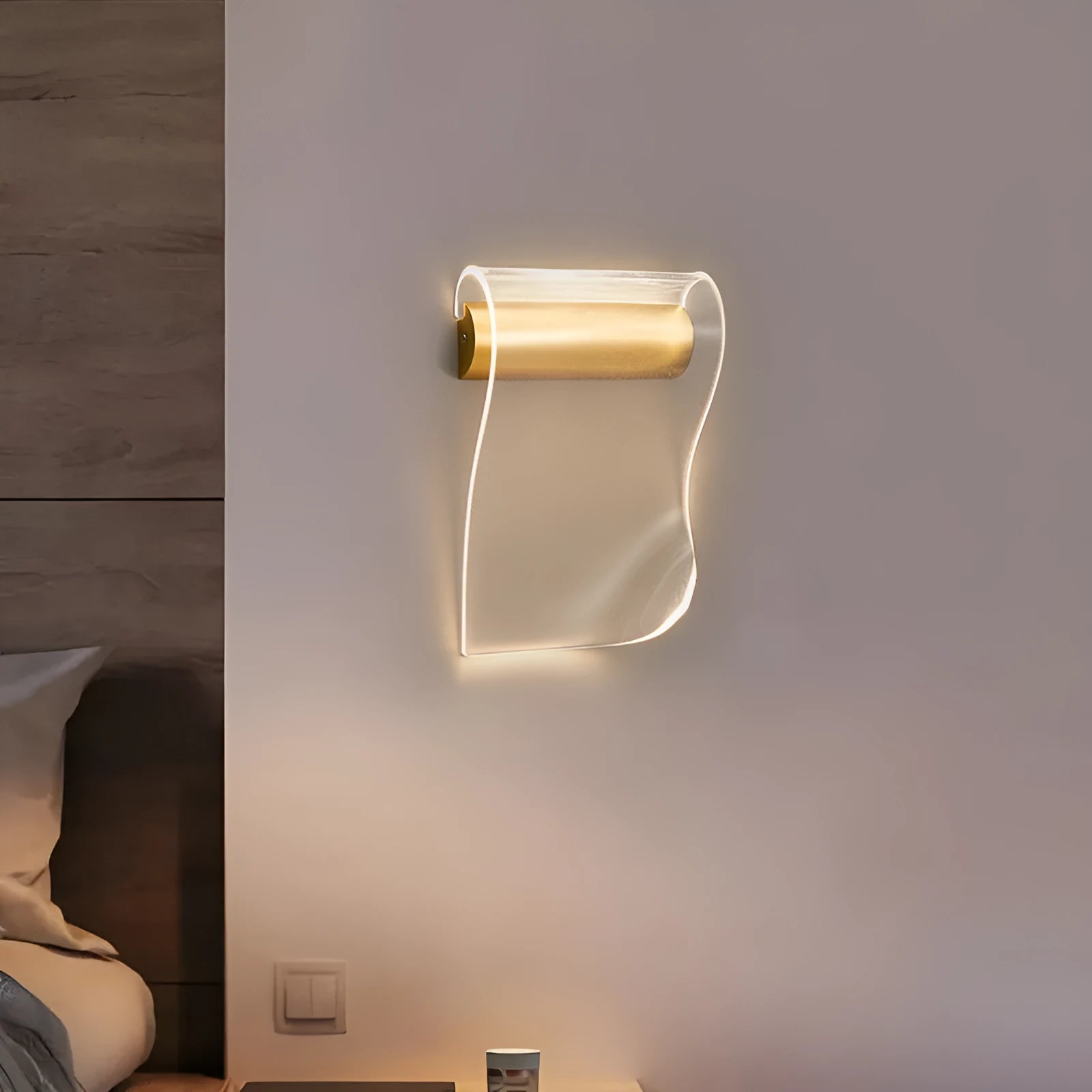 Modern wall lamp with acrylic shade and iron arm in a left bend design, mounted on a wall.