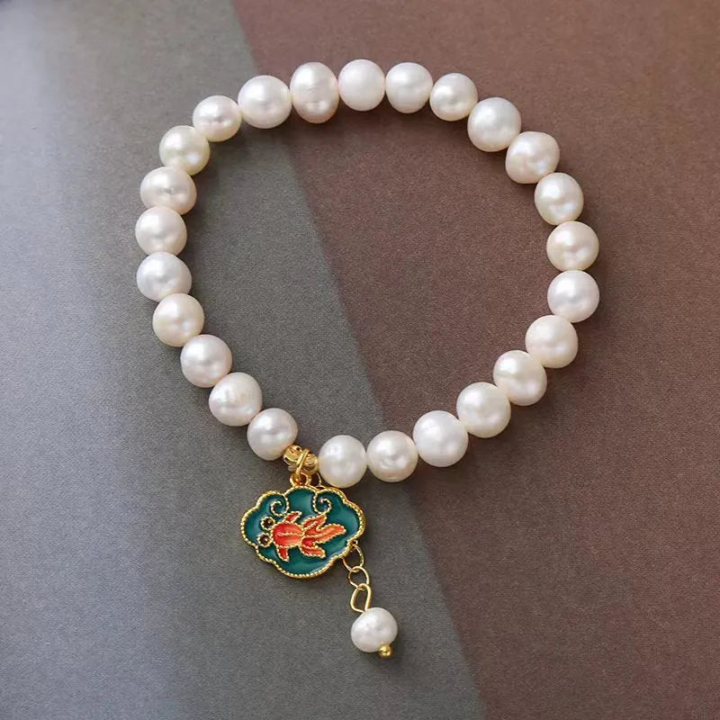 White freshwater pearl bracelet with goldfish pendant and lotus design in vintage baroque style
