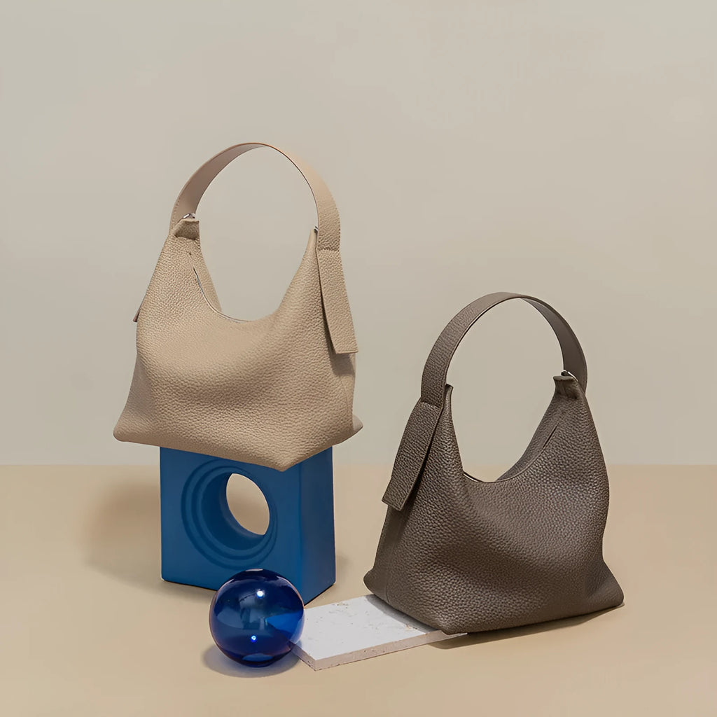 Casual first layer cowhide women's handbag in soft pillow shape with sewing line detail and single shoulder strap