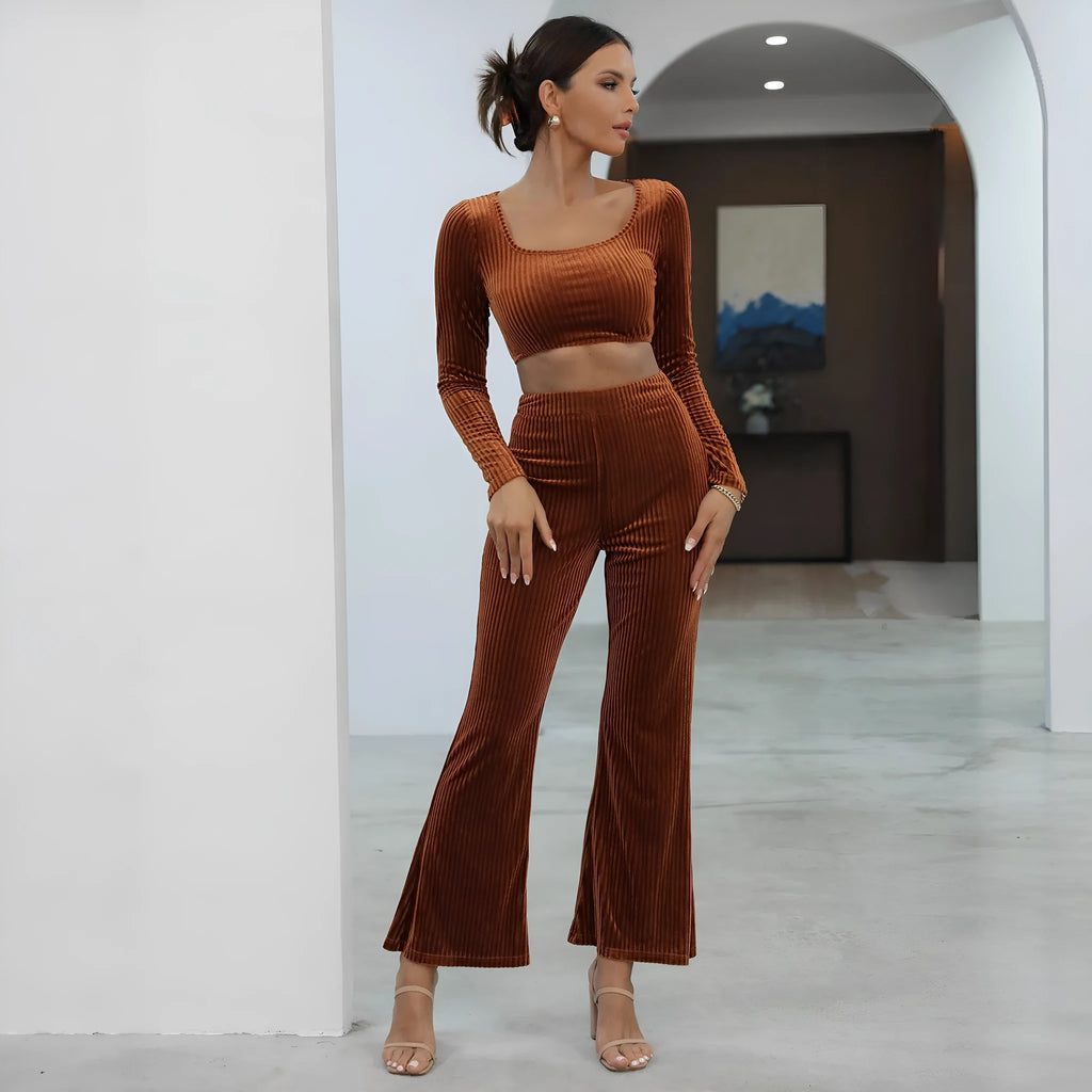 Caramel coloured women's long sleeve sweater and matching straight-leg trousers set on a hanger.