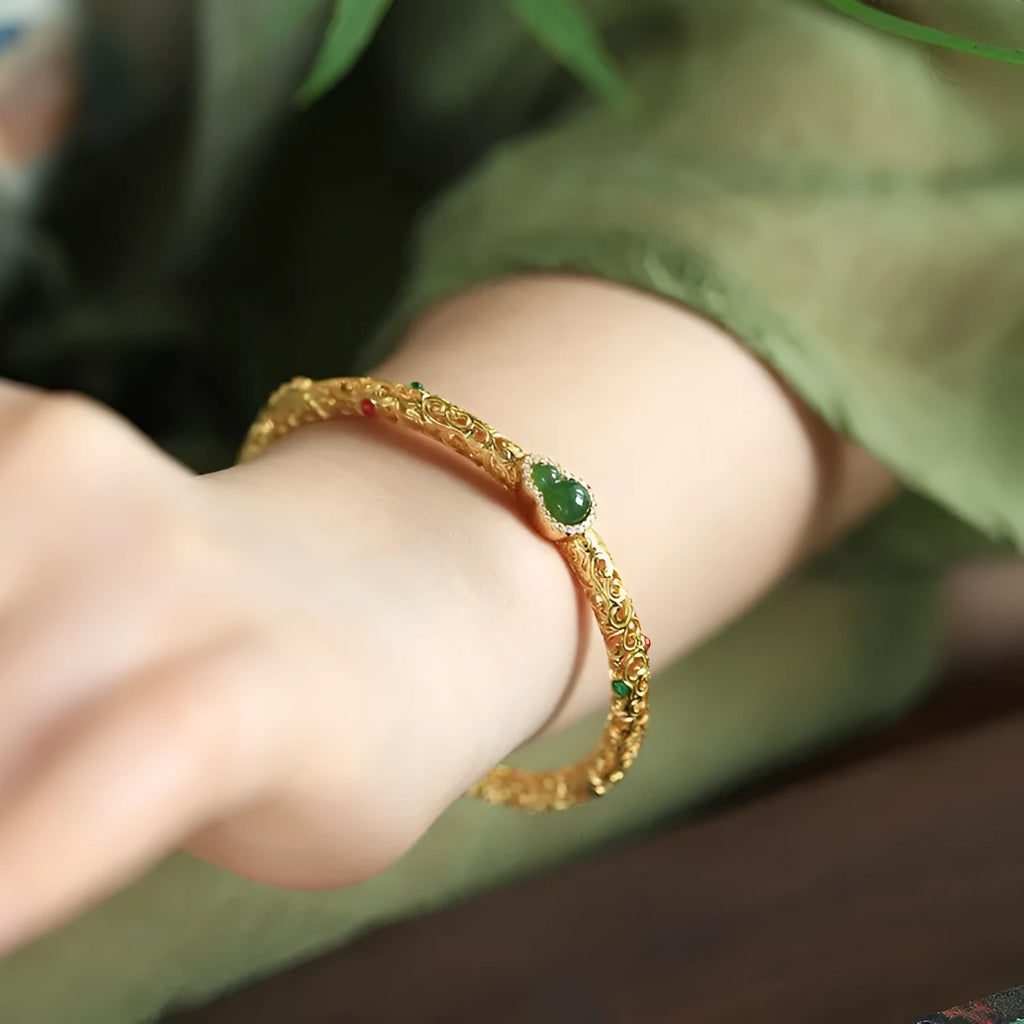 Gold-plated open back women's bracelet with traditional Chinese gourd charm on copper construction