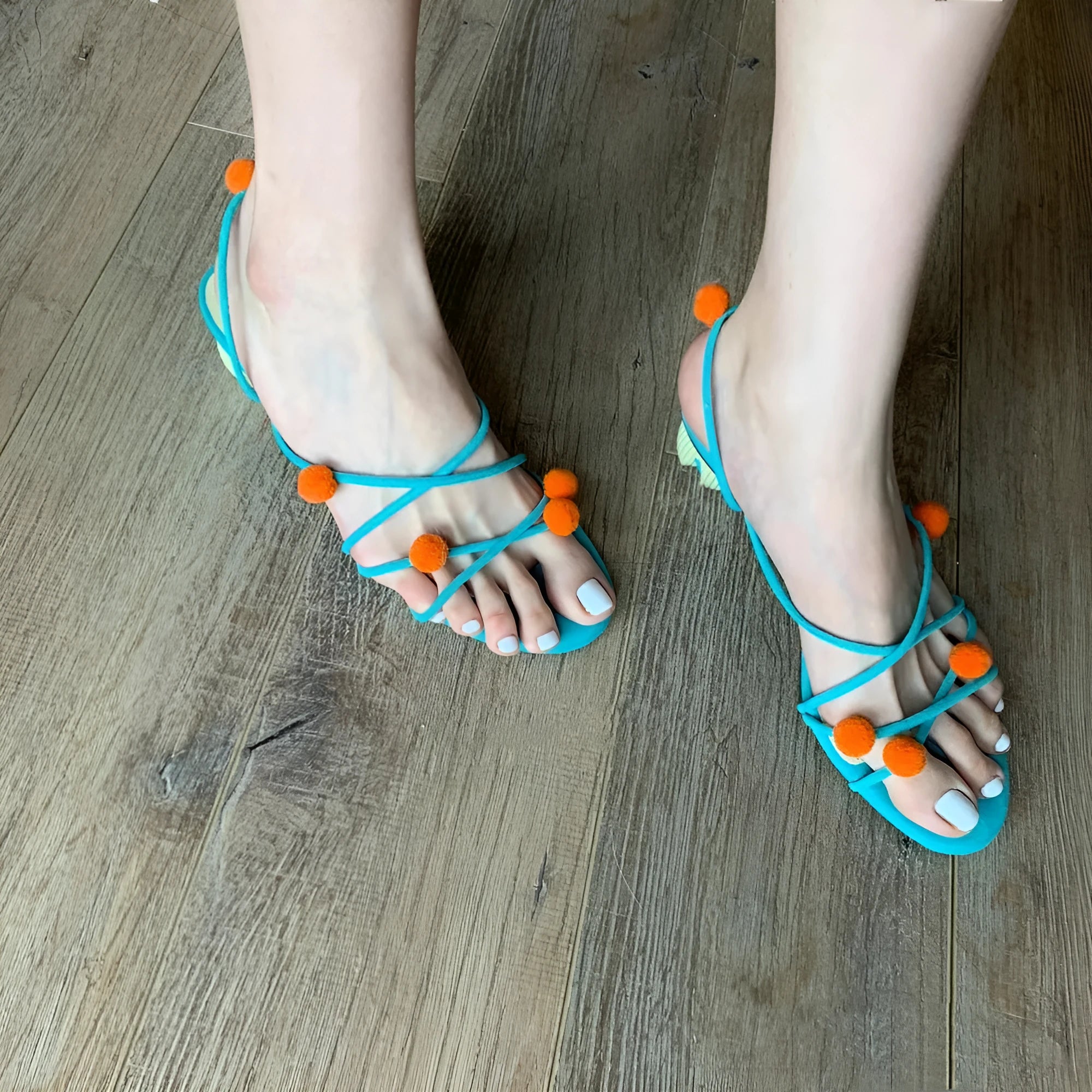 Cyan genuine leather women's sandals with lace-up straps, open toe, and a niche ball high heel.