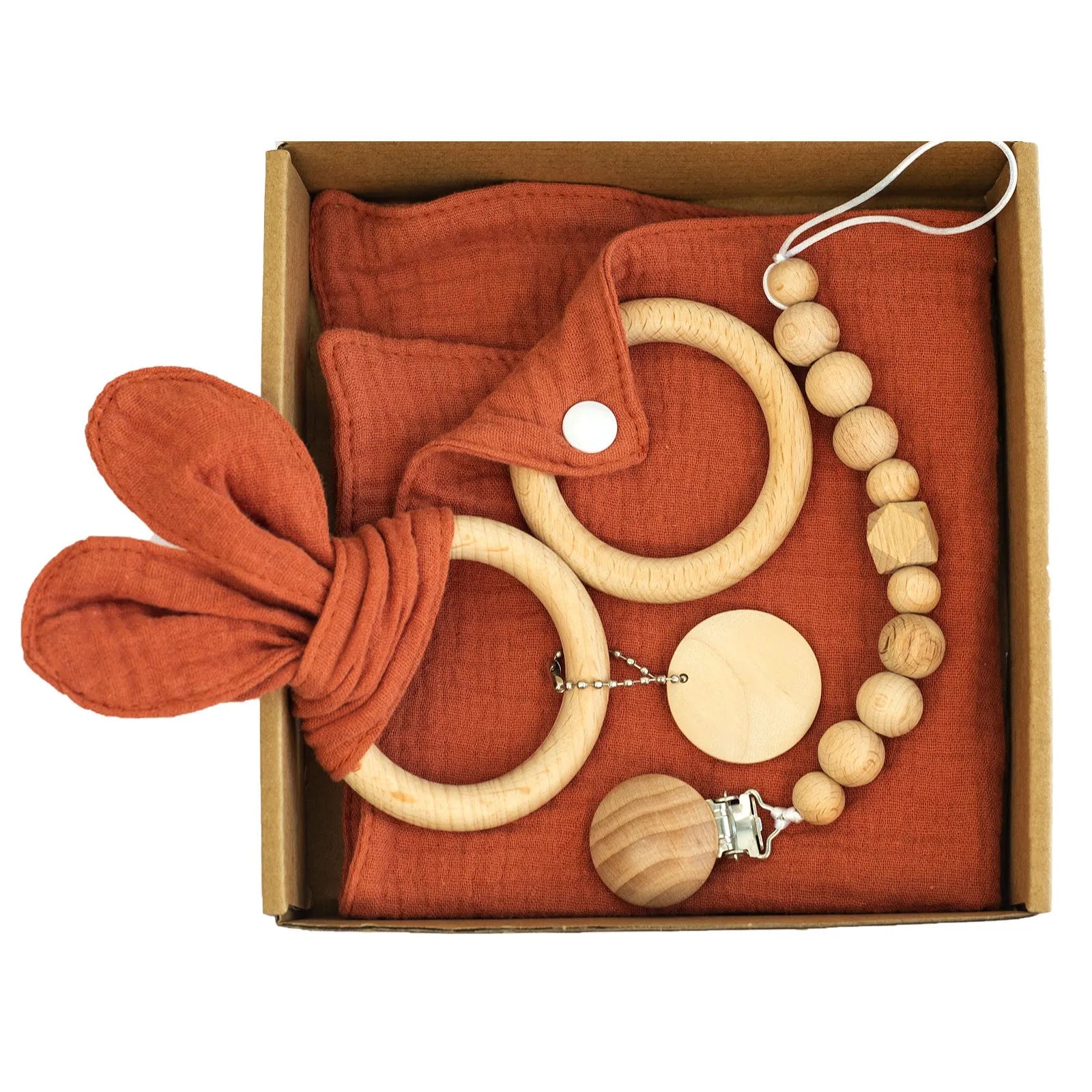 Baby teething toy gift set showing gauze blanket, wooden bell, gum teether, tire brush, and milestone on white background