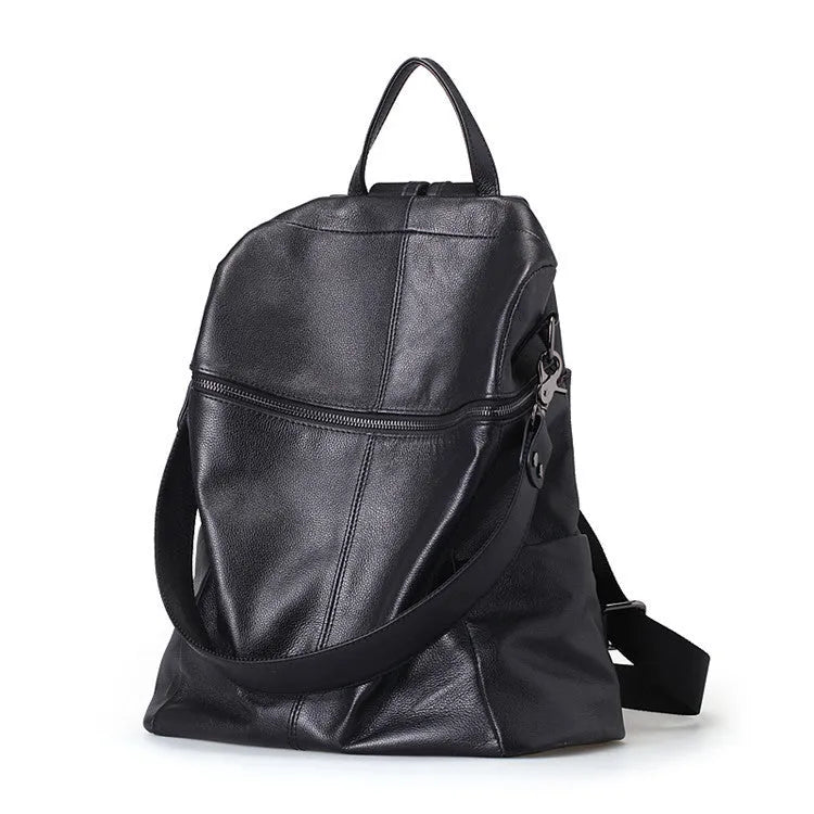 Brown genuine leather retro women's backpack with front pocket and adjustable straps.