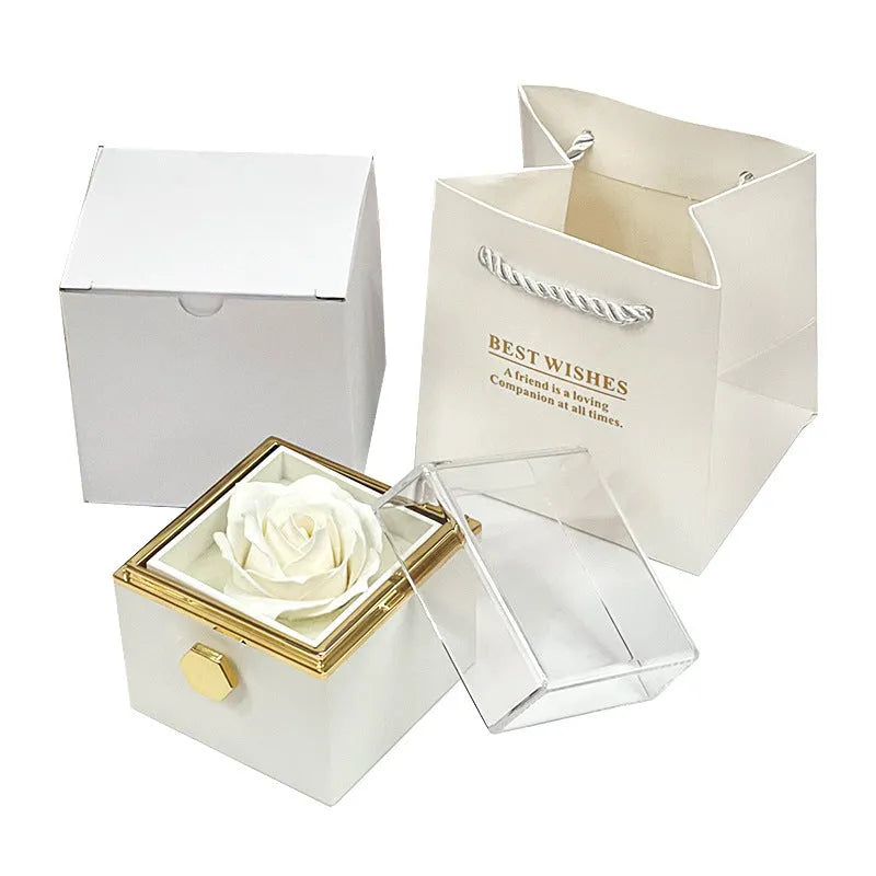 Rotating drawer jewellery gift box with red preserved rose under clear acrylic dome, showing open compartment.