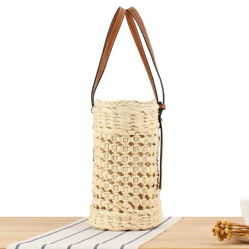 Horizontal square shoulder bag woven from paper-string with adjustable strap in beige colour