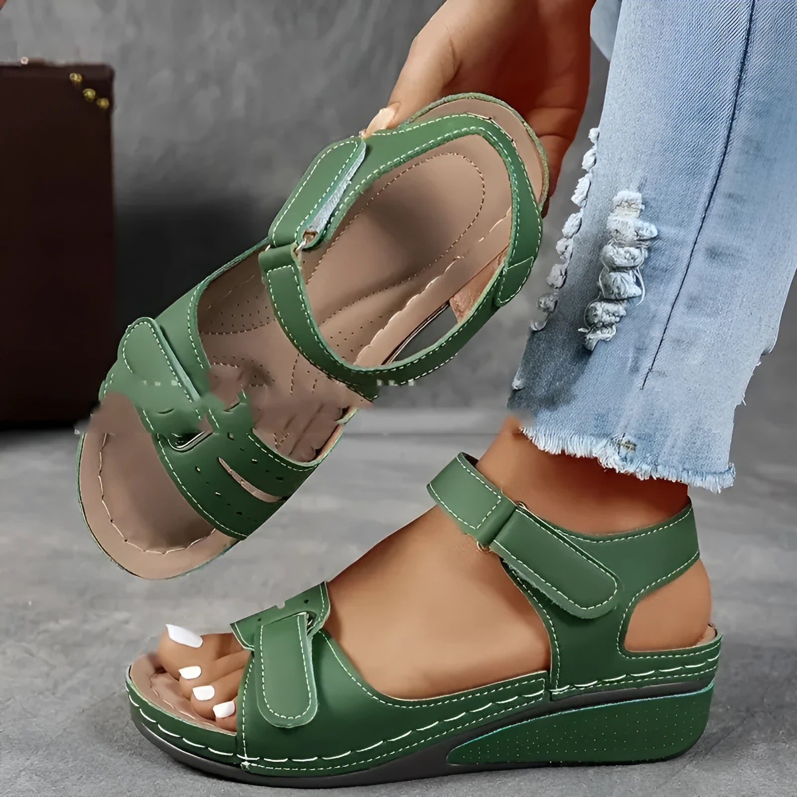 Women's beige thick-bottom strap sandals showing the Velcro fastener and round toe design.