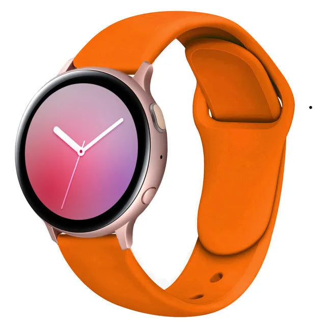 Samsung Galaxy Active 2 watch with a purple reverse buckle silicone strap on a wrist.