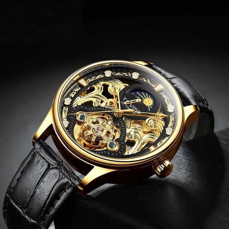Men's gold leather strap automatic mechanical watch with analogue dial on wrist.