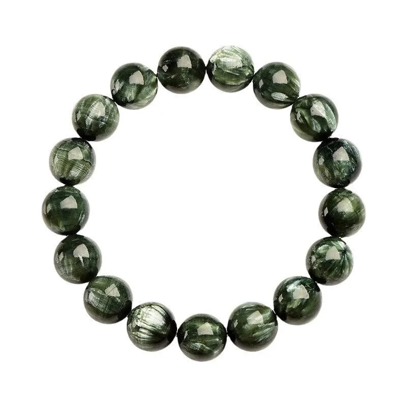 A bracelet made of polished green dragon crystal round beads with a geometric Ruyi design element.