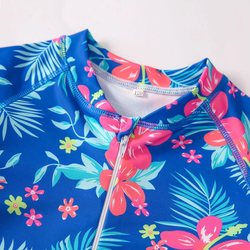 Girl's long sleeve one-piece swimming costume in a bright colour on a hanger