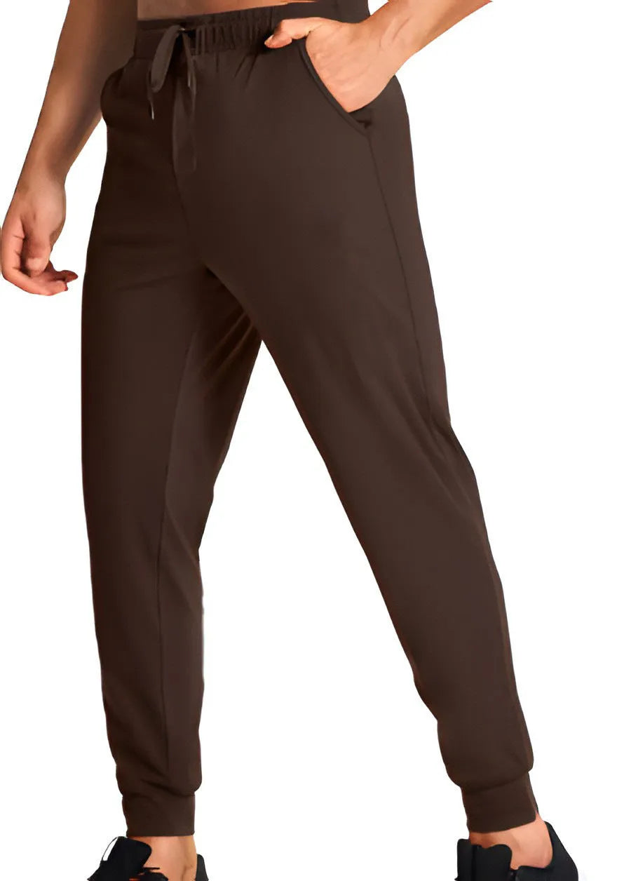 Man wearing loose-fit solid colour casual trousers made from polyester fabric.