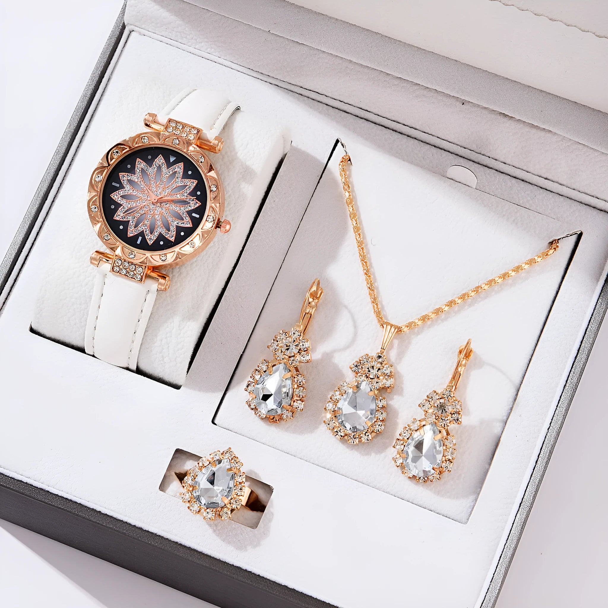 Women's quartz watch bracelet set with faux leather strap, round dial, and matching necklace ring earrings