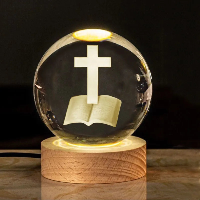 White crystal ball desk ornament on a wooden warm light base, showing purity-themed designs.